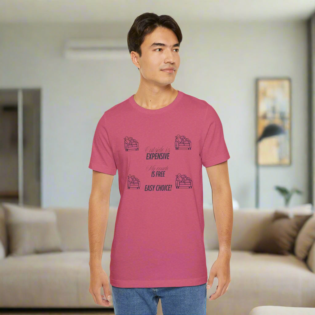 Man wearing a pink t-shirt with text in a living room