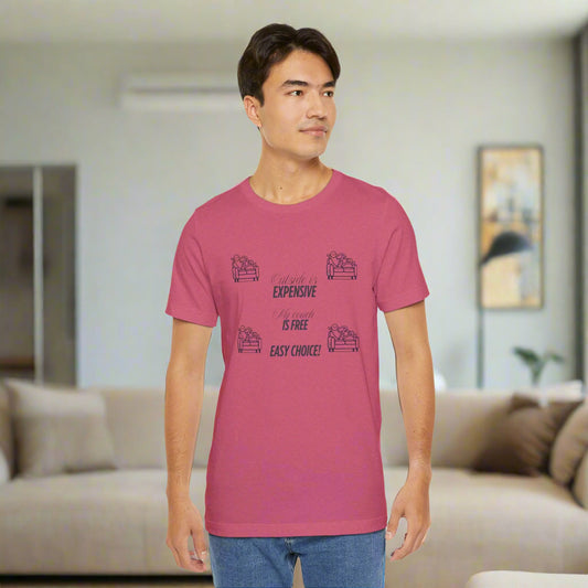 Man wearing a pink t-shirt with text in a living room